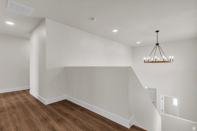 578 West 7th Midvale, UT 84047 - Photo 9 of 35 Hallway with dark wood-style floors and a chandelier