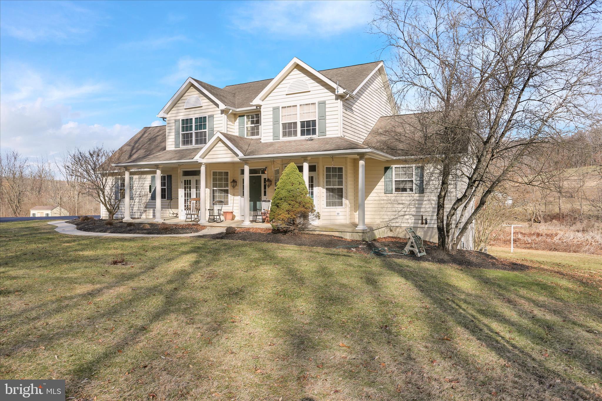 261 Sittler Valley Road Kutztown, PA 19530 - Photo 1 of 62 a front view of a house with a yard table and chairs