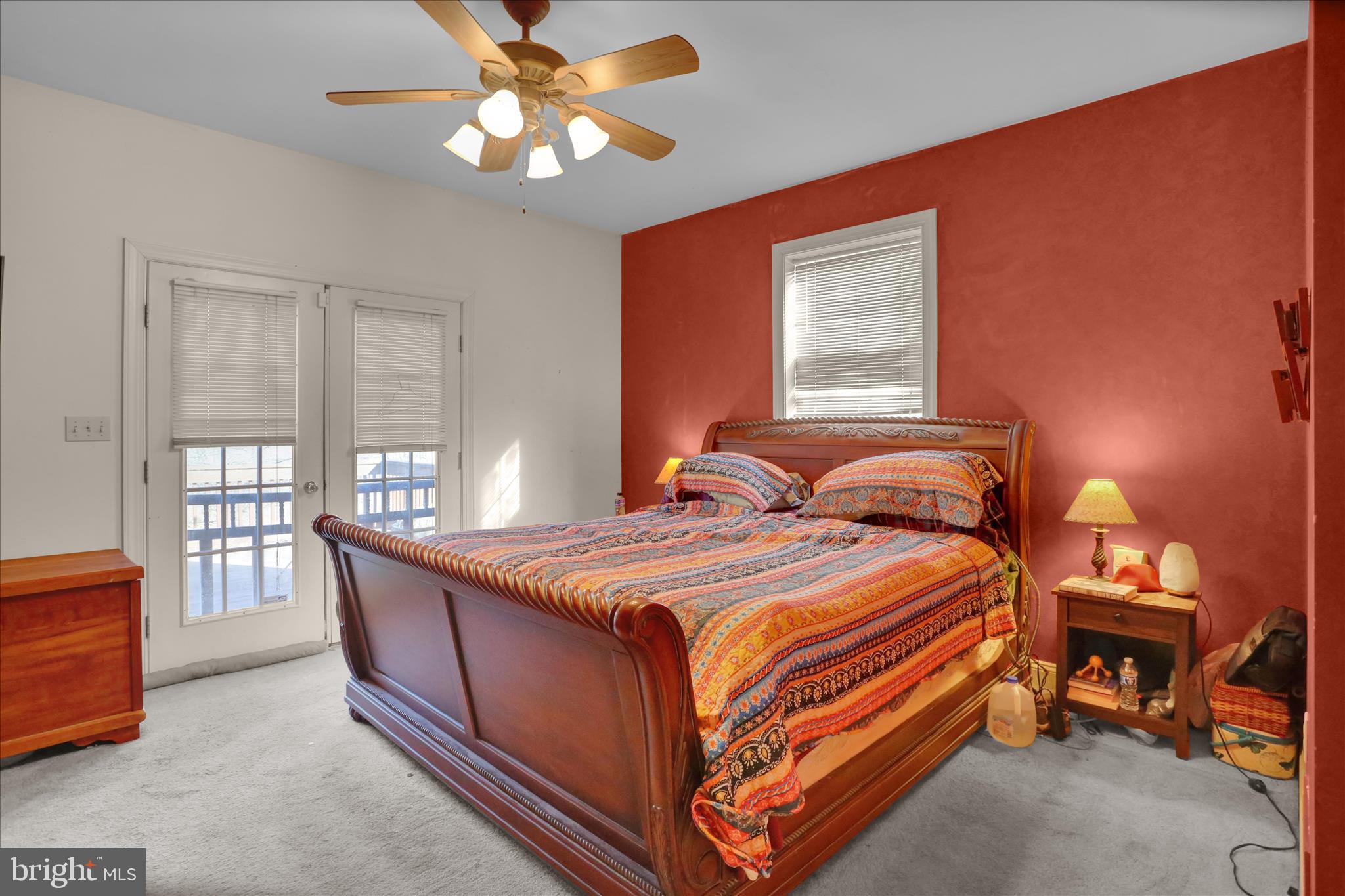 261 Sittler Valley Road Kutztown, PA 19530 - Photo 33 of 62 a bedroom with a bed and a chandelier