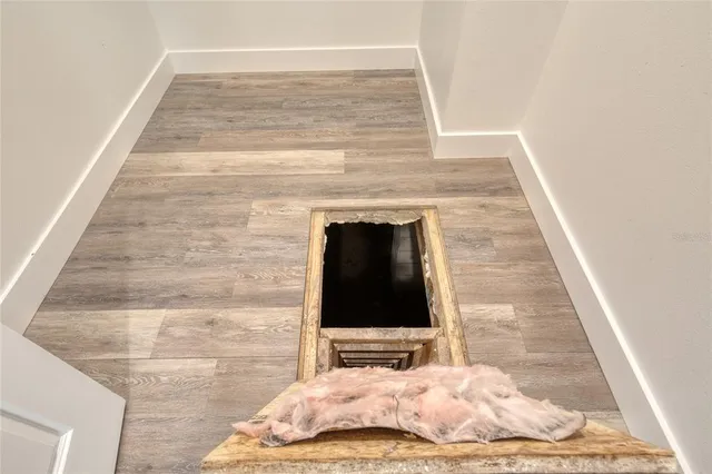 a bathroom with a granite countertop sink a shower and a mirror