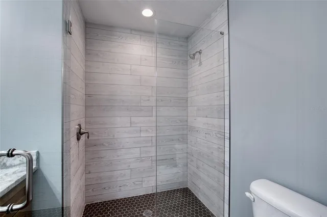 a bathroom with double vanity sinks and a mirror