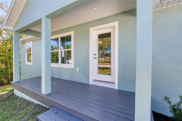 a view of an entryway of house with wooden floor