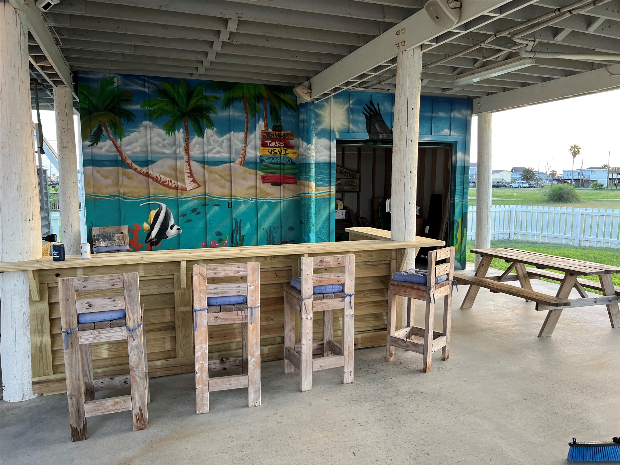 307 Angel Wing Street Surfside Beach, TX 77541 - Photo 17 of 23 The party starts here! Custom built bar with vibrant beach-inspired mural is the perfect place to unwind!
