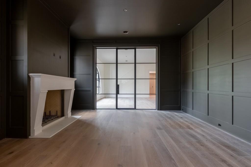 615 Hickory Flat Road Milton, GA 30004 - Photo 11 of 64 a view of an empty room with a fireplace and a window