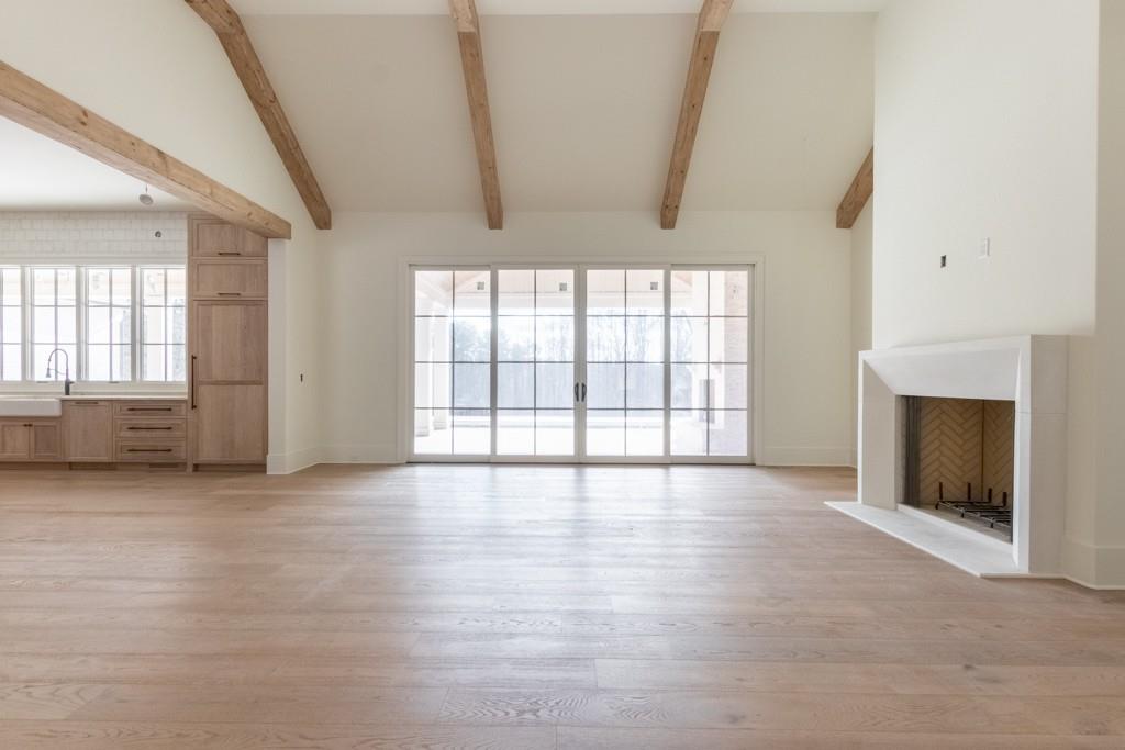 615 Hickory Flat Road Milton, GA 30004 - Photo 12 of 64 an empty room with windows and fireplace