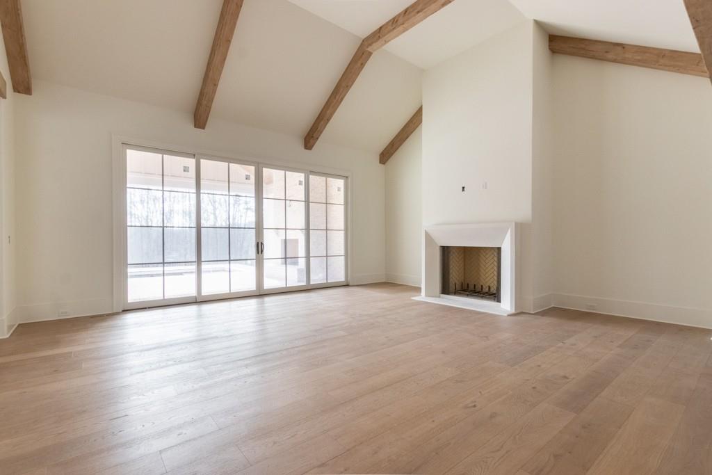 615 Hickory Flat Road Milton, GA 30004 - Photo 13 of 64 a view of an empty room with a fireplace and a window