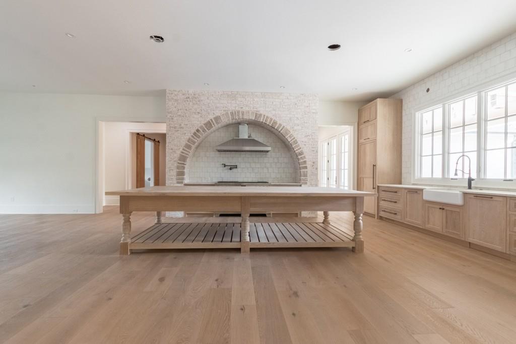 615 Hickory Flat Road Milton, GA 30004 - Photo 18 of 64 a living room with a couch and a wooden floor