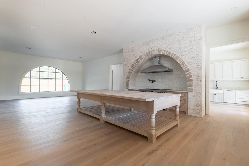 615 Hickory Flat Road Milton, GA 30004 - Photo 20 of 64 a living room with stainless steel appliances kitchen island hardwood floor and a window