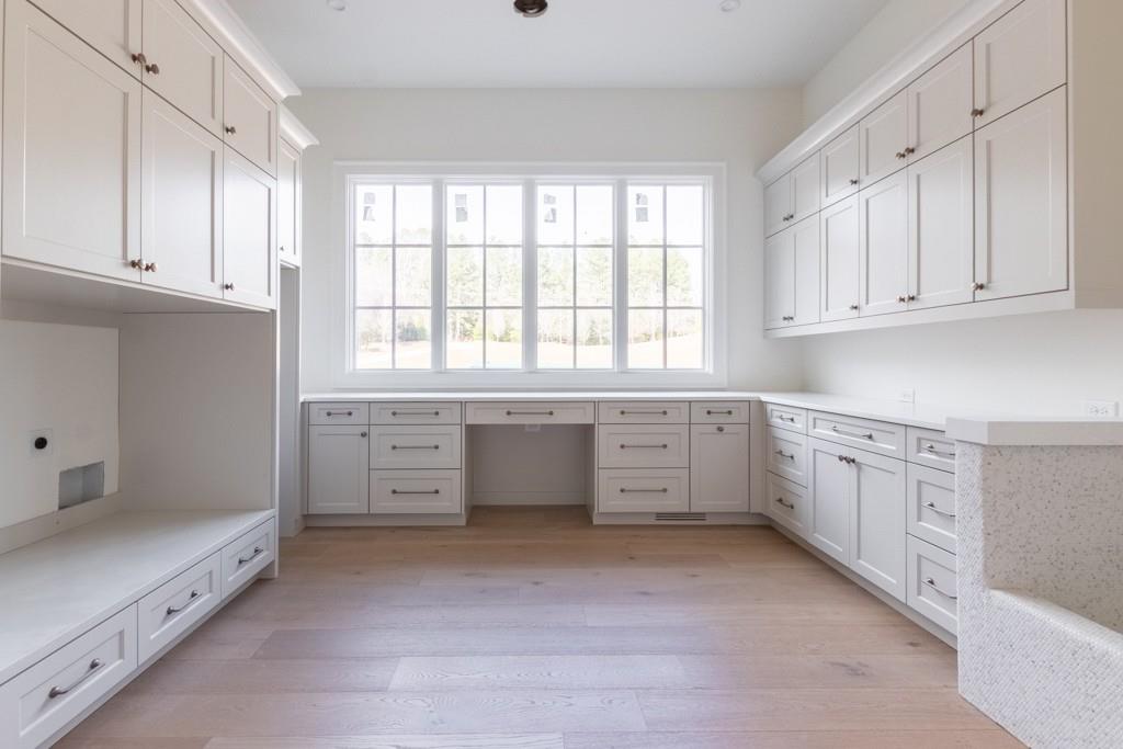 615 Hickory Flat Road Milton, GA 30004 - Photo 30 of 64 a kitchen with white cabinets and window