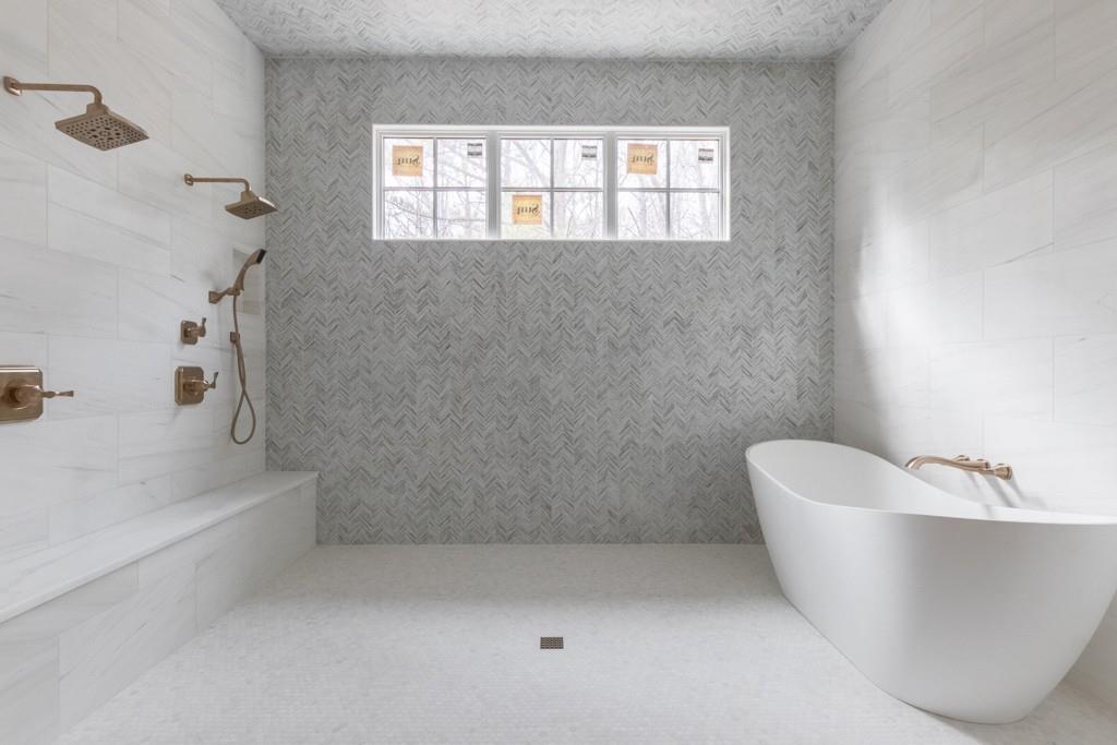 615 Hickory Flat Road Milton, GA 30004 - Photo 39 of 64 a bathroom with a bathtub