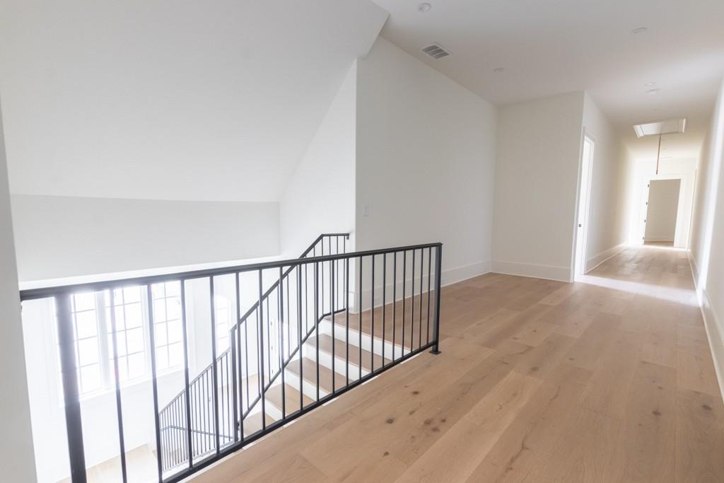 615 Hickory Flat Road Milton, GA 30004 - Photo 43 of 64 a view of a hallway with wooden floor