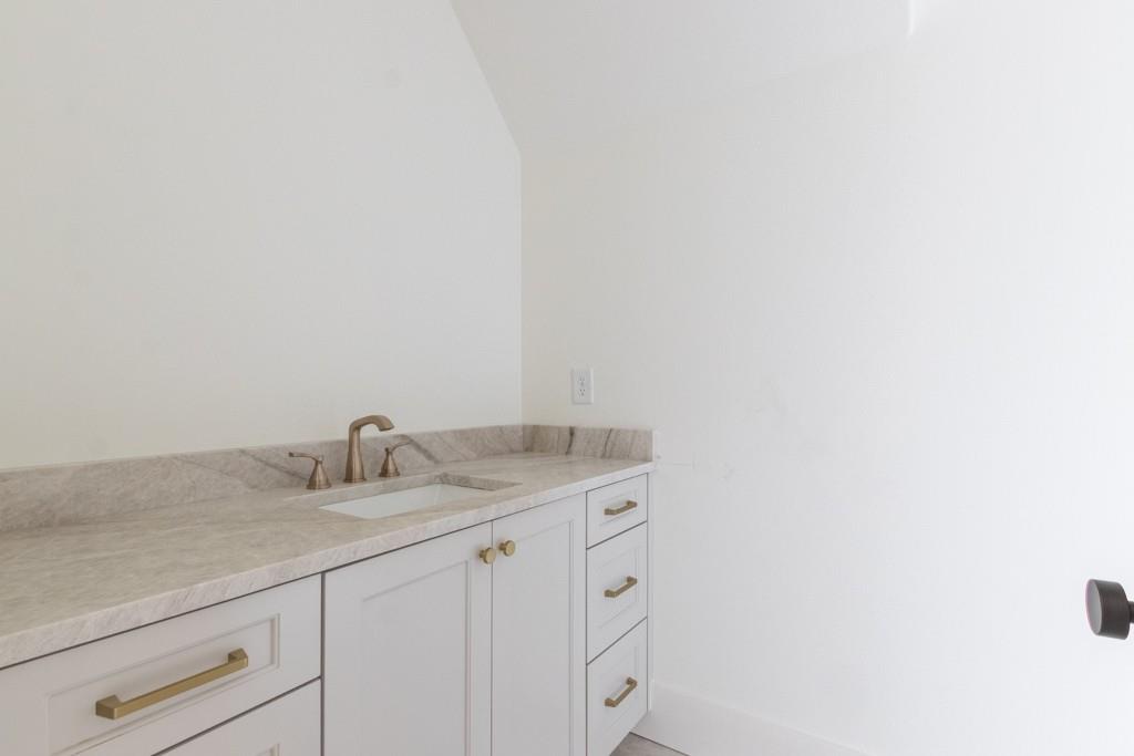 615 Hickory Flat Road Milton, GA 30004 - Photo 45 of 64 a bathroom with a granite countertop sink and vanity