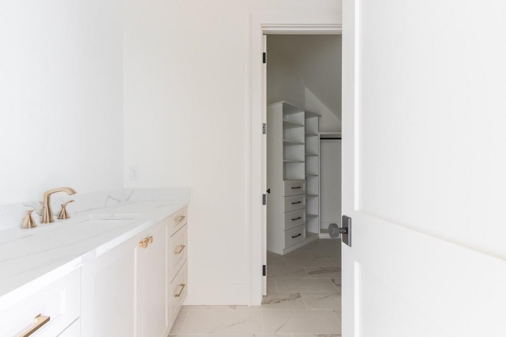 615 Hickory Flat Road Milton, GA 30004 - Photo 51 of 64 a bathroom with a sink and a mirror