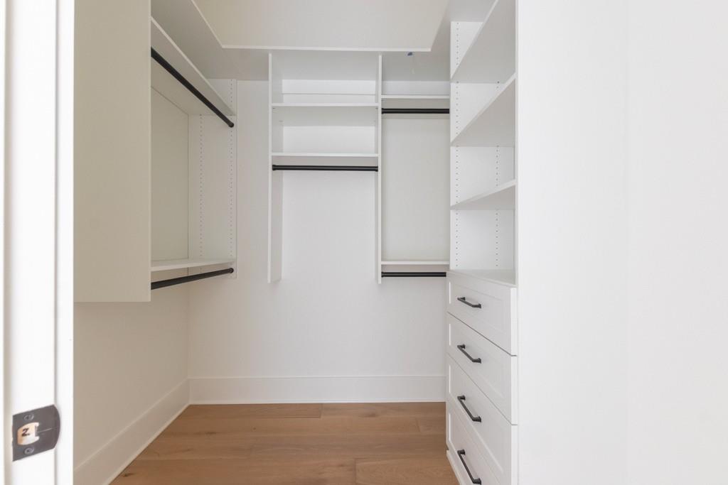 615 Hickory Flat Road Milton, GA 30004 - Photo 58 of 64 a view of walk in closet with empty racks