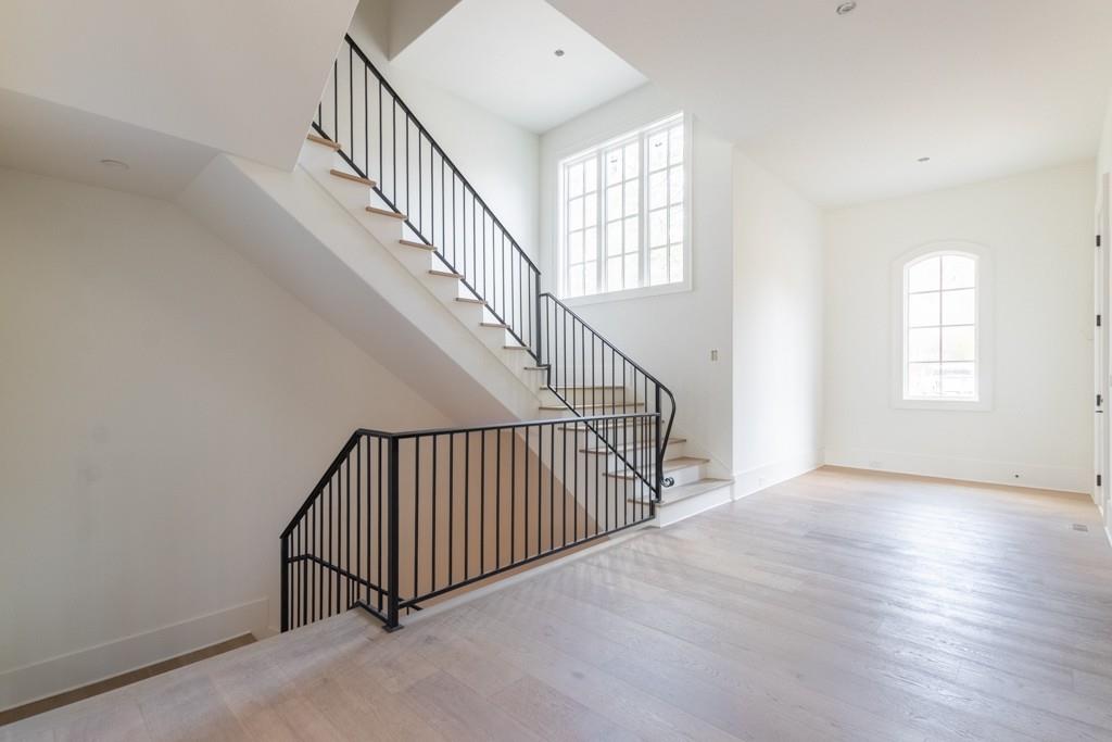 615 Hickory Flat Road Milton, GA 30004 - Photo 10 of 64 a view of staircase with white walls and a window