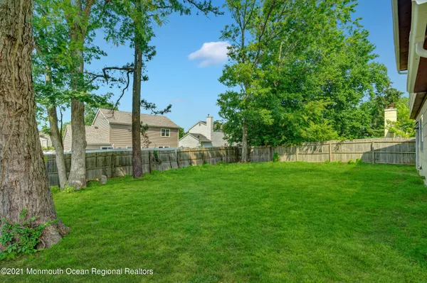 a view of house with backyard space and garden