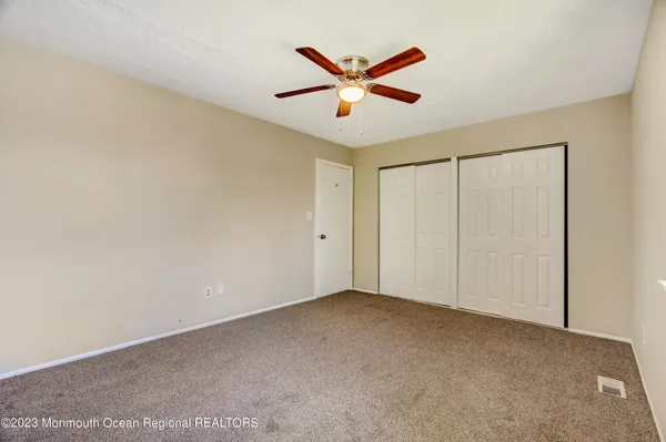 a view of house with backyard space and garden