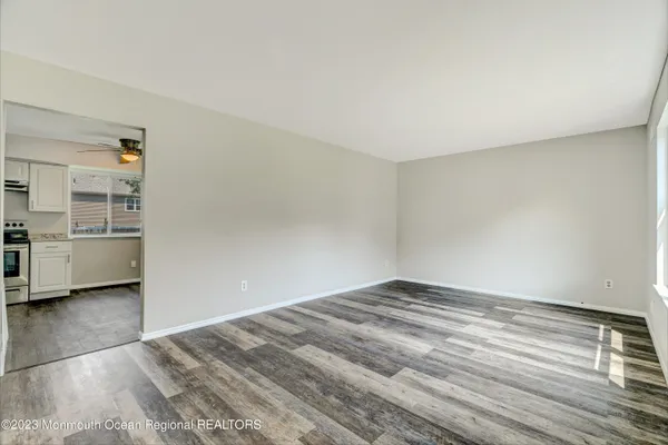 a kitchen with a refrigerator and cabinets