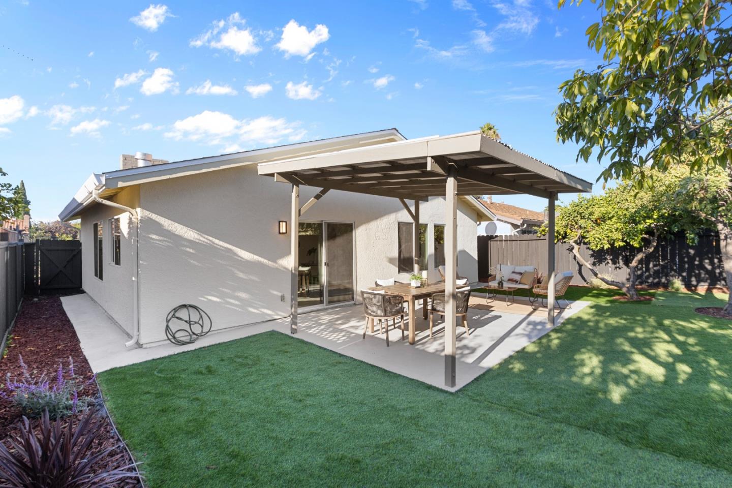 262 Checkers Drive San Jose, CA 95116 - Photo 16 of 17 a view of a house with backyard and sitting area
