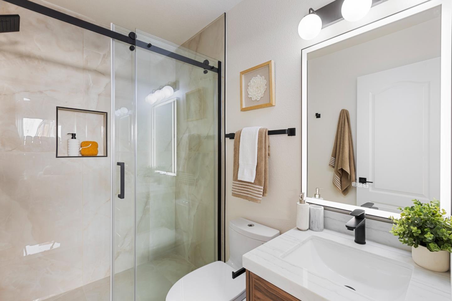 262 Checkers Drive San Jose, CA 95116 - Photo 10 of 17 a bathroom with a sink toilet and shower