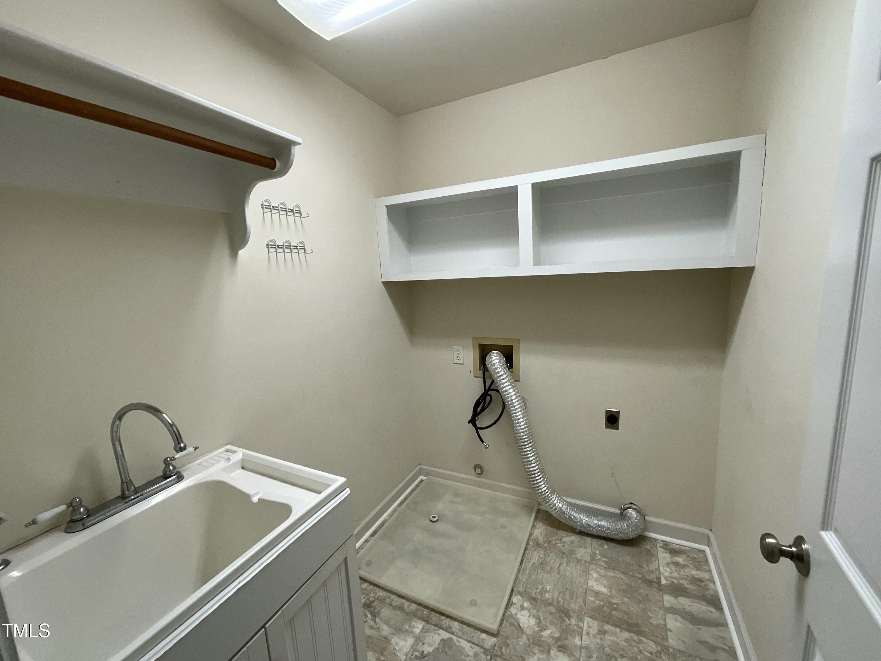 7721 Sutcliffe Drive Raleigh, NC 27613 - Photo 14 of 31 2nd flr laundry