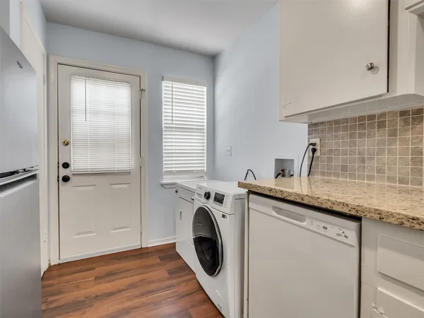 a view of a kitchen with washer and dryer