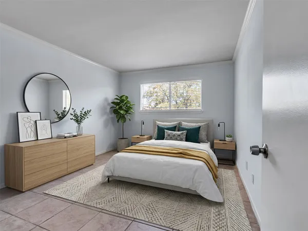 a bedroom with a bed and a dresser