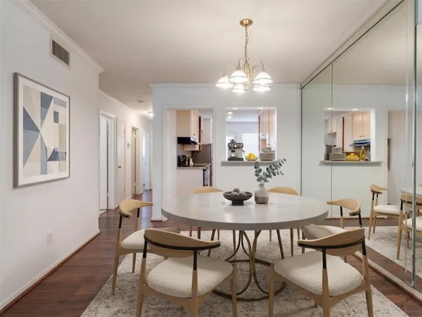a view of a dining room with furniture and chandelier