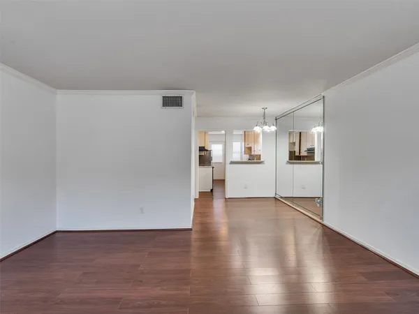 a view of a kitchen with wooden floor