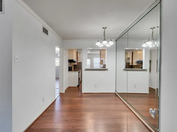 a view of a kitchen with a refrigerator and a stove