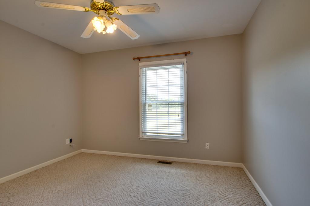 7342 Taylor Road Fairview, TN 37062 - Photo 11 of 17 Secondary bedrooms are 11x11 and have ceiling fans.