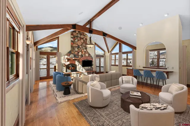 a living room with furniture and a large window