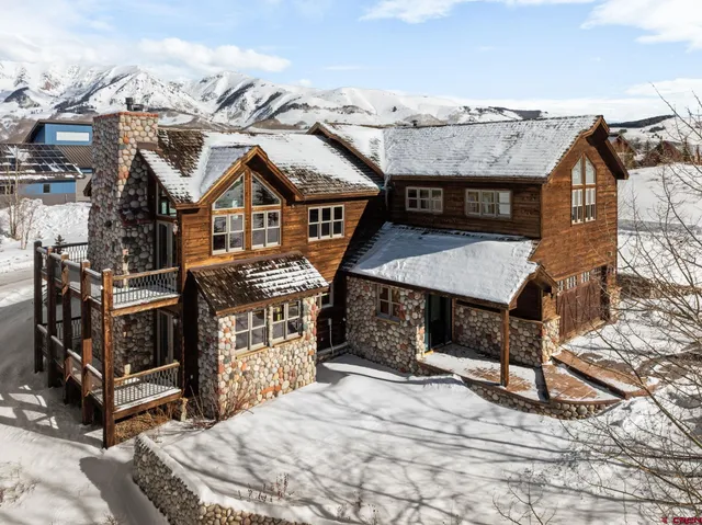 a view of a house with roof deck front of house