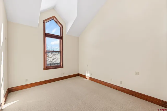 a view of an empty room and a window