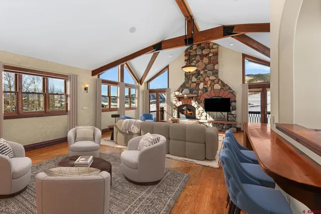 a living room with furniture and a large window