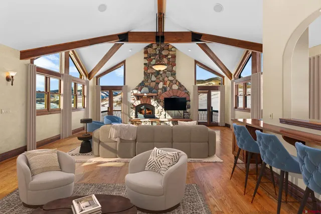 a living room with furniture and a chandelier