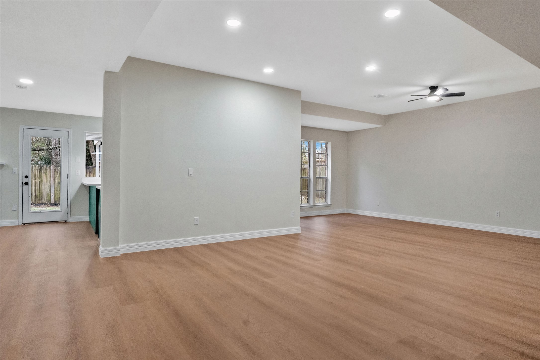 3 Still Corner Place Spring, TX 77381 - Photo 18 of 41 Seamless connection between the main living, dining, and entertainment spaces, offering multiple layout options and excellent natural light.