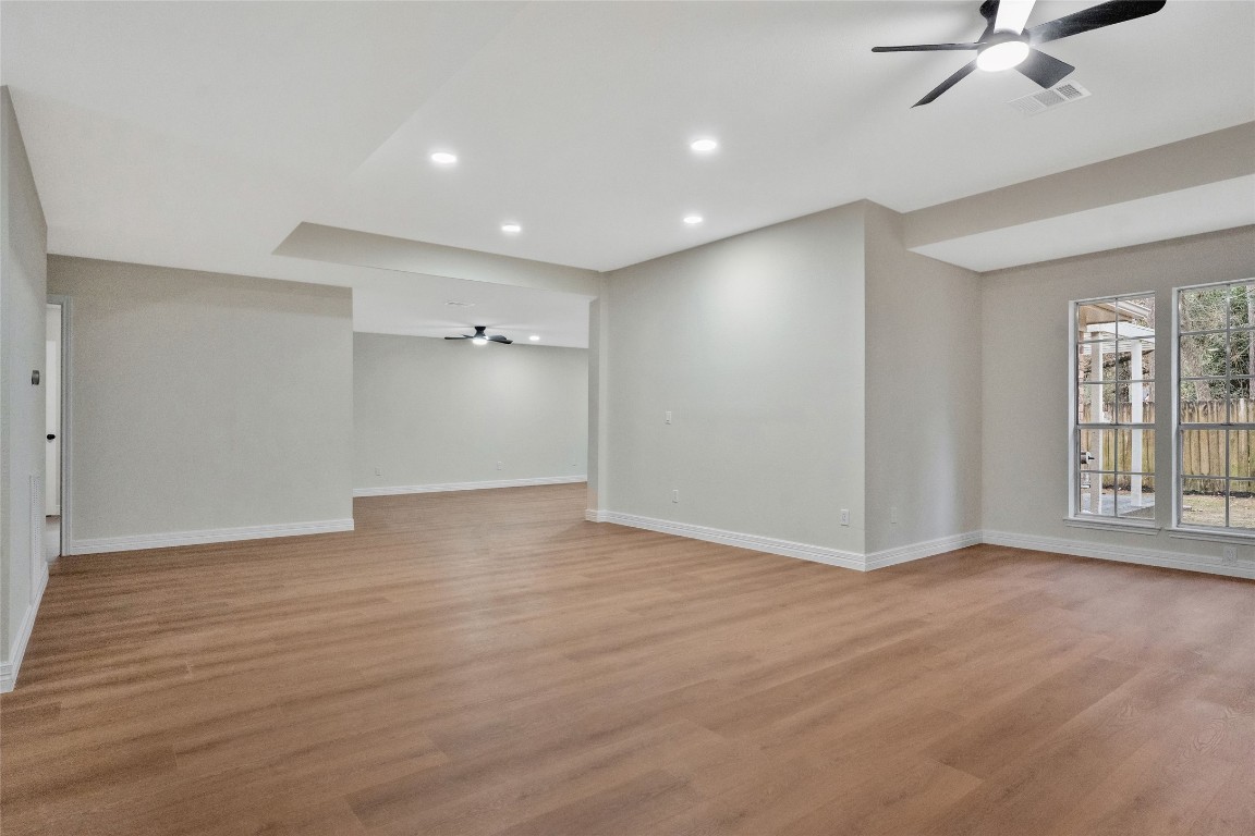 3 Still Corner Place Spring, TX 77381 - Photo 20 of 42 Additional open living space just off the main area, perfect for a den, breakfast nook, or casual gathering area, with easy access to the kitchen.