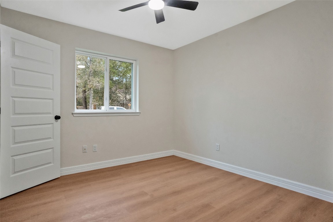 3 Still Corner Place Spring, TX 77381 - Photo 27 of 42 Secondary bedroom located on the opposite side of the home from the primary suite, offering added privacy and separation.