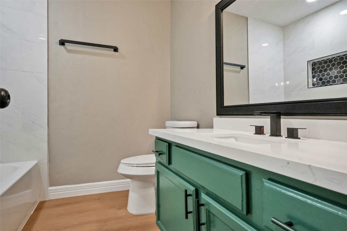 3 Still Corner Place Spring, TX 77381 - Photo 32 of 42 Updated secondary bathroom featuring a white quartz vanity, modern fixtures, and stylish cabinetry with ample storage.