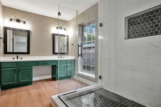 a kitchen with granite countertop a stove top oven microwave and cabinets