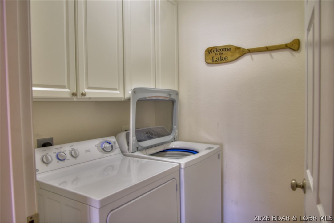275 Flynn Road, Unit 106 Lake Ozark, MO 65049 - Photo 15 of 39 Walk-in laundry room with full size washer & dryer
