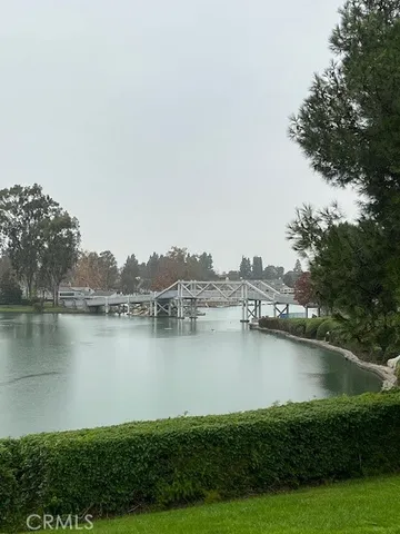 a view of a lake with houses in the back