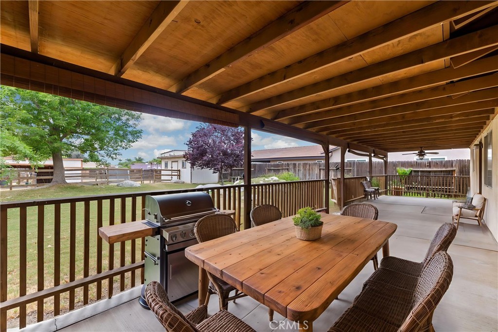 2065 Jenkins Road Bakersfield, CA 93314 - Photo 43 of 59 a view of a patio with a table chairs and a table