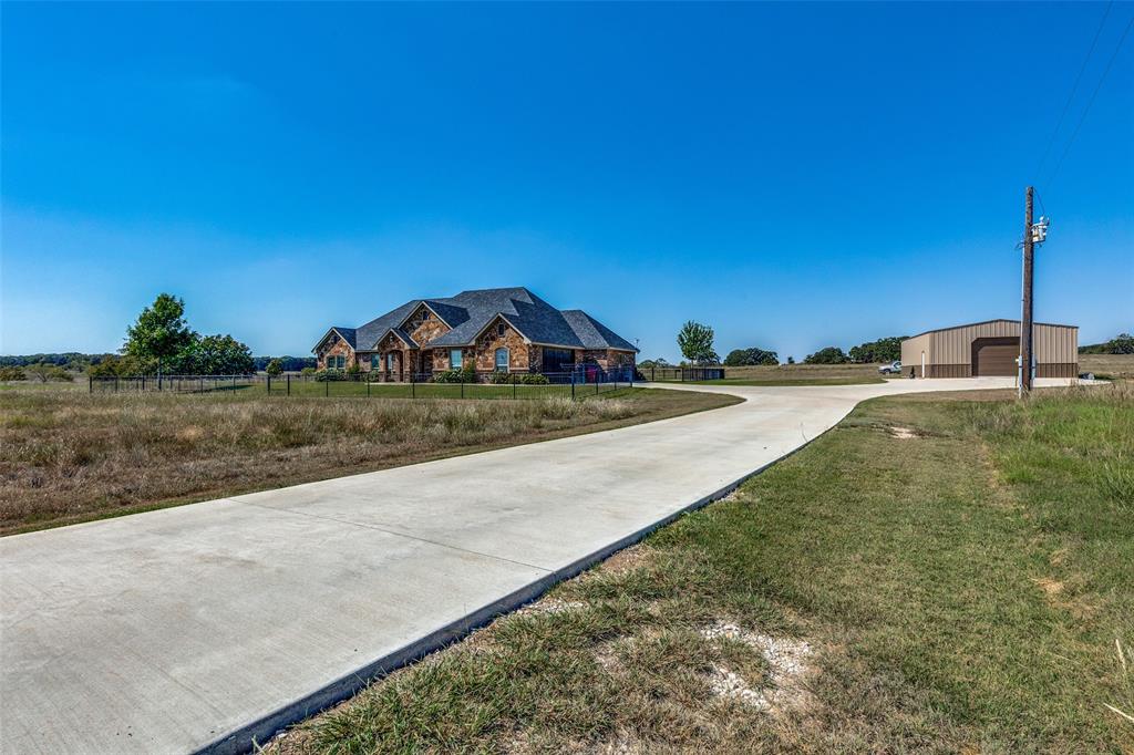 1150 Lone Star Road Bowie, TX 76230 - Photo 14 of 38 a view of swimming pool with a yard