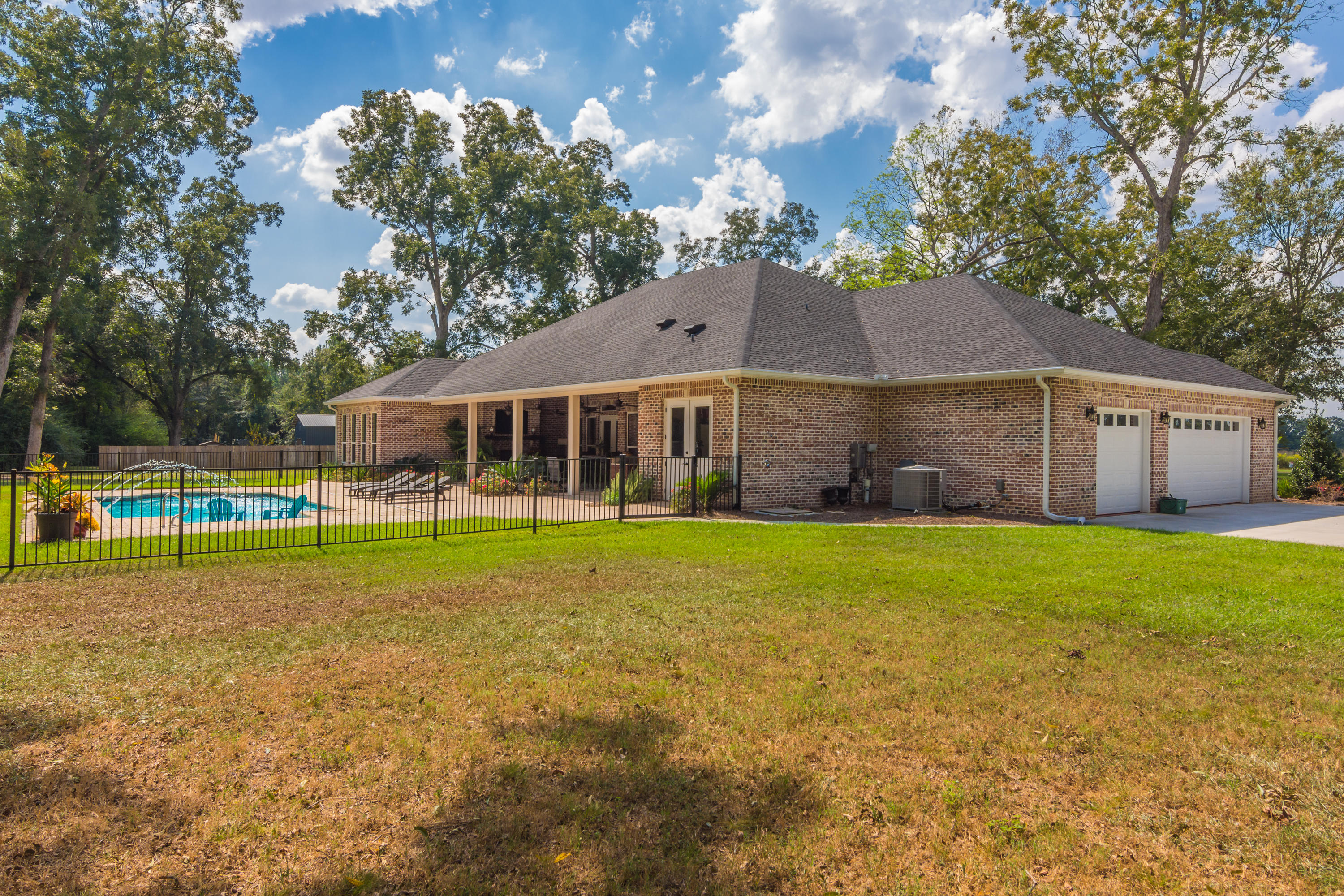 5973 Jack Stokes Road Baker, FL 32531 - Photo 50 of 61 a view of a house with a yard and sitting area
