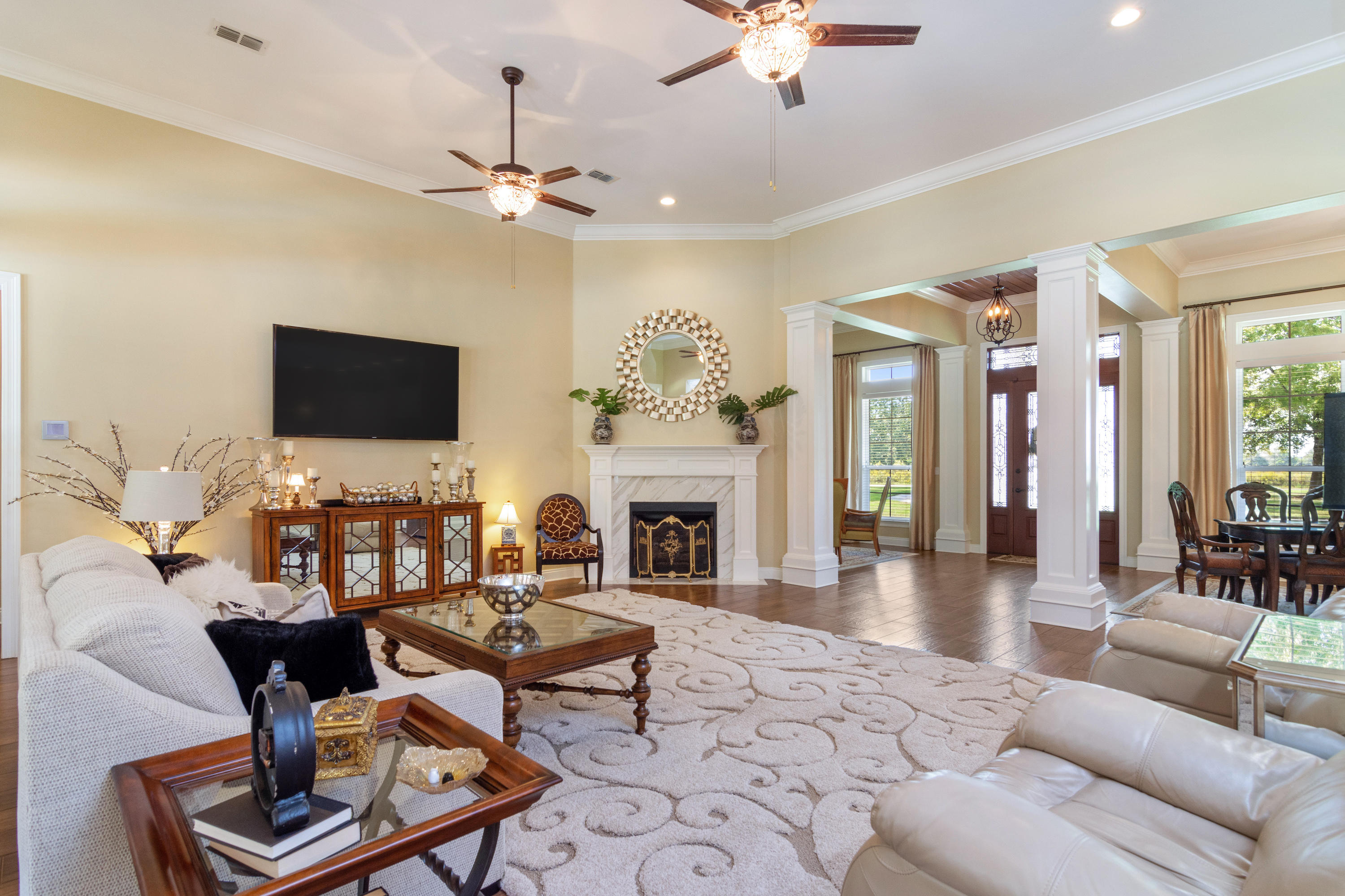 5973 Jack Stokes Road Baker, FL 32531 - Photo 9 of 61 a living room with furniture a fireplace and a flat screen tv
