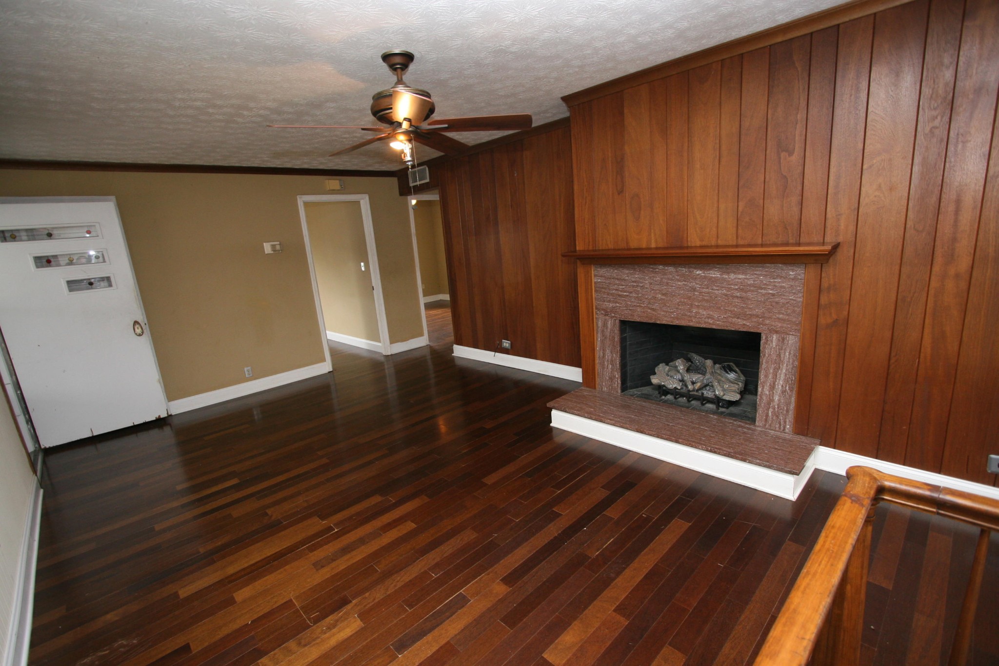 116 East Pasadena Road Oak Ridge, TN 37830 - Photo 3 of 30 a view of a livingroom with wooden floor and a fireplace