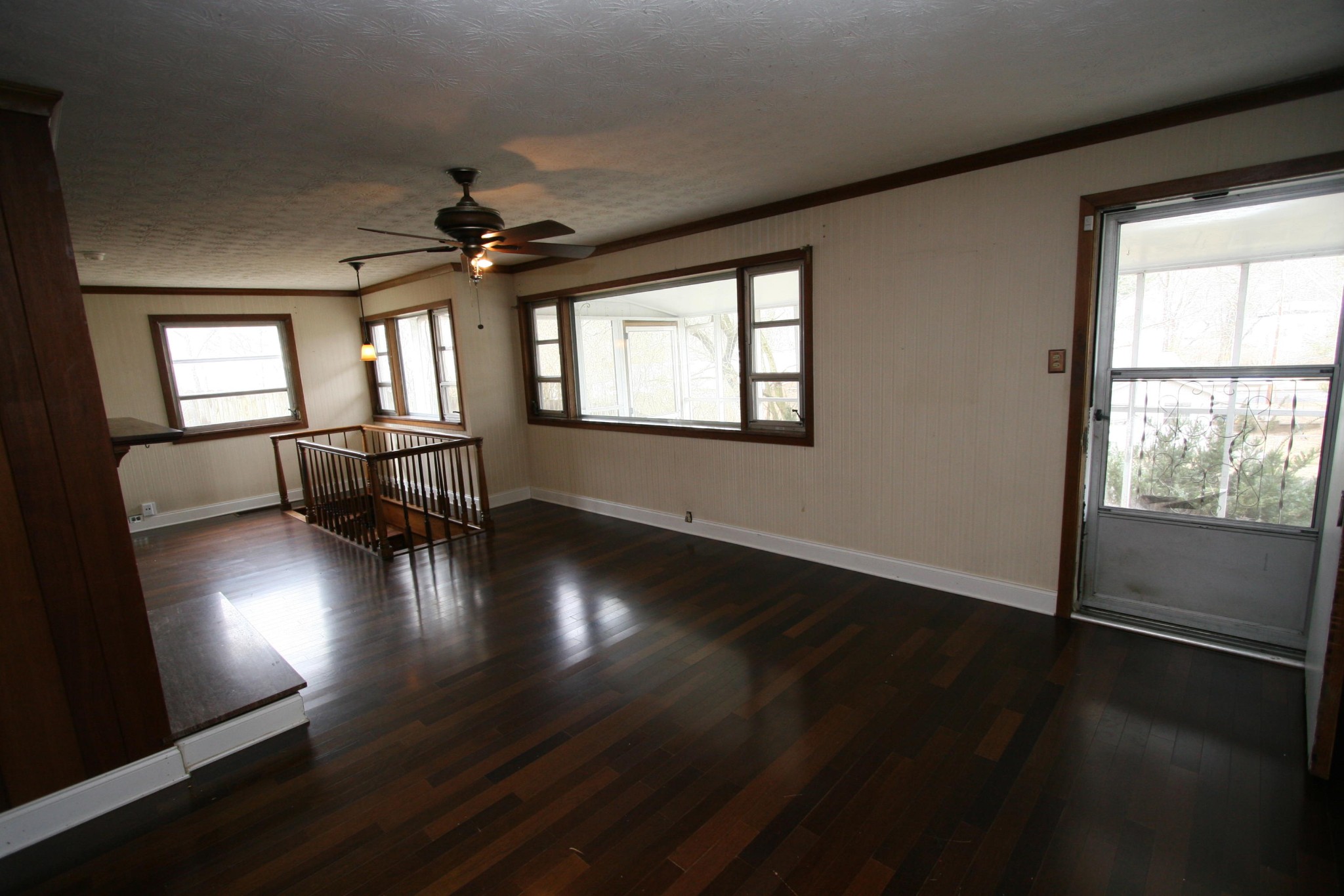 116 East Pasadena Road Oak Ridge, TN 37830 - Photo 8 of 30 an empty room with wooden floor and windows