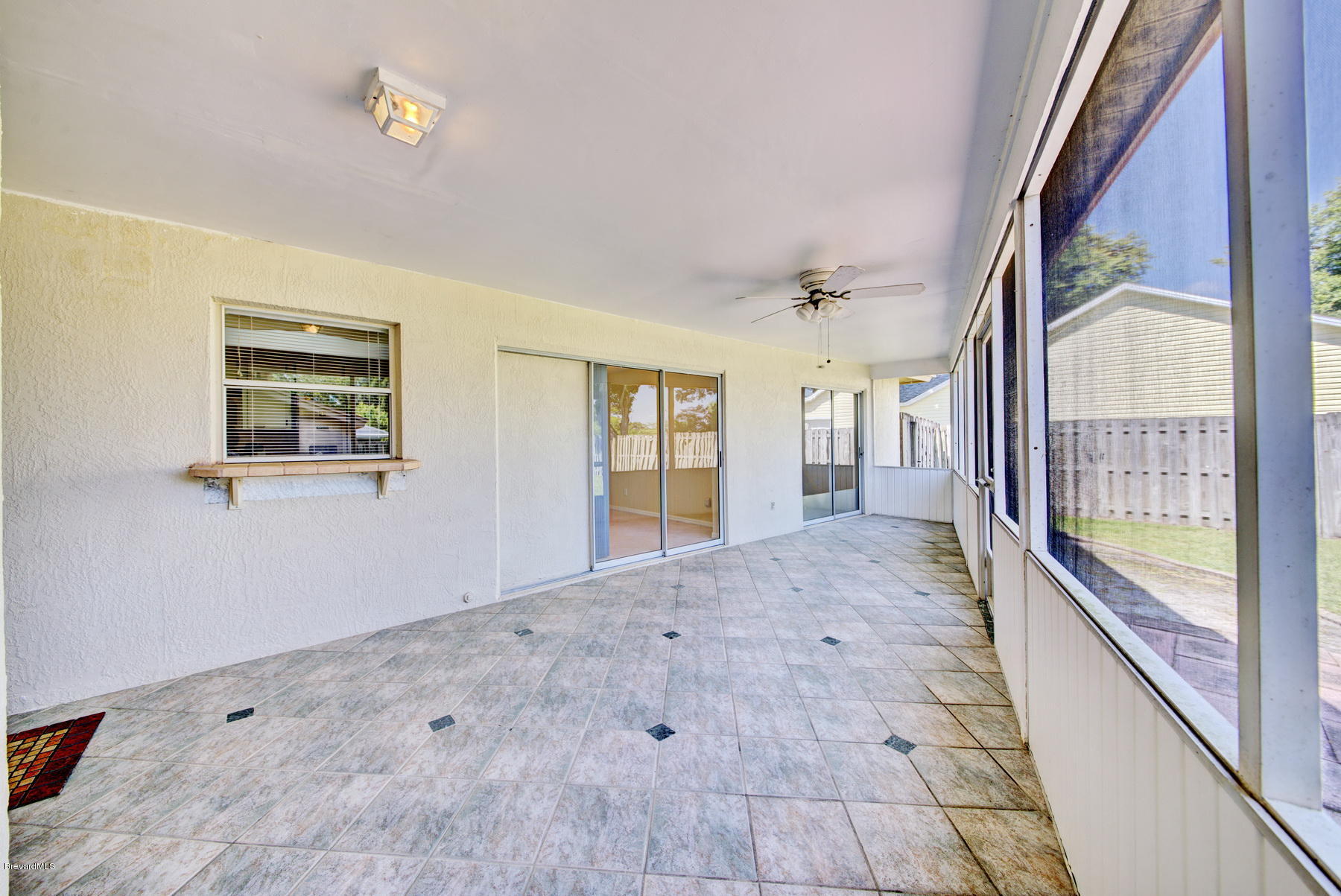 162 Crystal Lake Road Melbourne, FL 32901 - Photo 10 of 11 a view of an empty room and window
